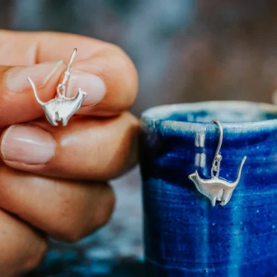 Sitting Silver Cat Earrings, handmade with Sustainable Silver, Hand Shot