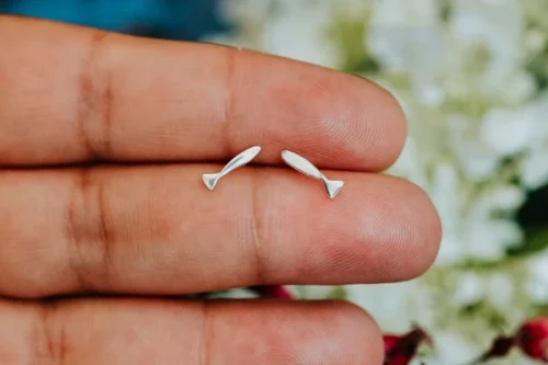 Fish Stud, handmade with Sustainable Silver, Hand Shot