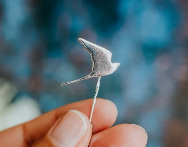 Kestrel Pin, handmade with Sustainable Silver, Hand Shot