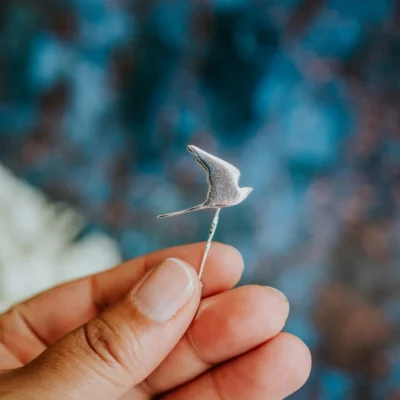 Kestrel Pin, handmade with Sustainable Silver, Hand Shot Zoom