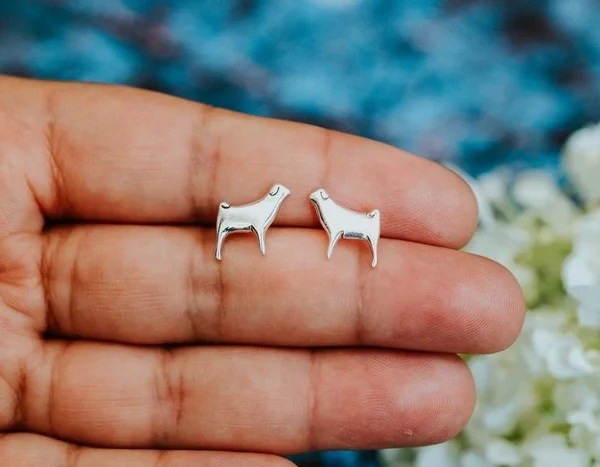 Pug Dog Studs, handmade with Sustainable Silver, Hand Shot