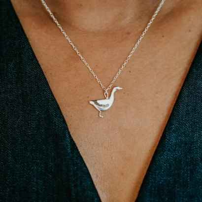 Snow Goose Necklace, handmade with Sustainable Silver, Model Shot