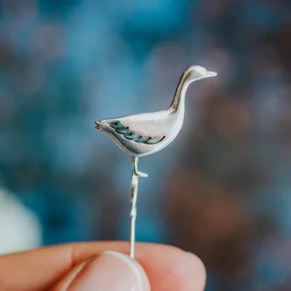 Snow Goose Pin, handmade with Sustainable Silver, Hand Shot