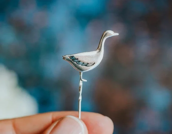 Snow Goose Pin, handmade with Sustainable Silver, Hand Shot