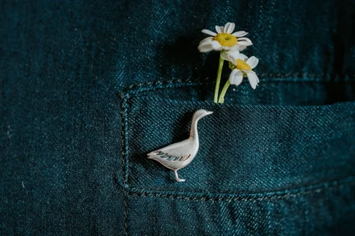 Snow Goose Pin, handmade with Sustainable Silver, Model Shot
