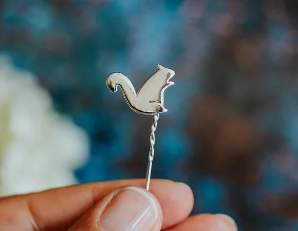Squirrel Pin, handmade with Sustainable Silver, Hand Shot