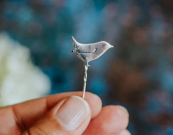 Wren Pin, handmade with Sustainable Silver, Hand Shot