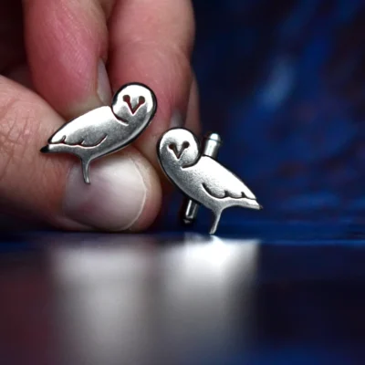 Handcrafted sterling silver owl cufflinks showcasing intricate owl design with delicate feather details, ethically sourced and handmade in the UK. Designed and handmade by Elouise Makes Jewellery