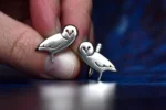 Handcrafted sterling silver owl cufflinks showcasing intricate owl design with delicate feather details, ethically sourced and handmade in the UK. Designed and handmade by Elouise Makes Jewellery