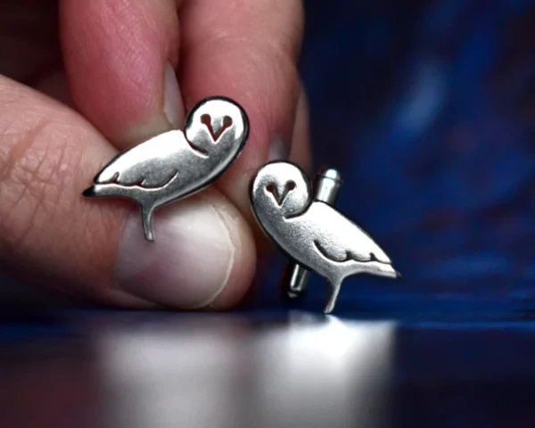Handcrafted sterling silver owl cufflinks showcasing intricate owl design with delicate feather details, ethically sourced and handmade in the UK. Designed and handmade by Elouise Makes Jewellery
