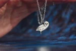 Handcrafted sterling silver owl necklace featuring a detailed owl pendant on an adjustable chain, ethically sourced and handmade in the UK. Designed and handmade by Elouise Makes Jewellery