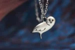 Handcrafted sterling silver owl necklace featuring a detailed owl pendant on an adjustable chain, ethically sourced and handmade in the UK. Designed and handmade by Elouise Makes Jewellery