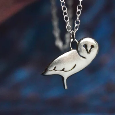 Handcrafted sterling silver owl necklace featuring a detailed owl pendant on an adjustable chain, ethically sourced and handmade in the UK. Designed and handmade by Elouise Makes Jewellery