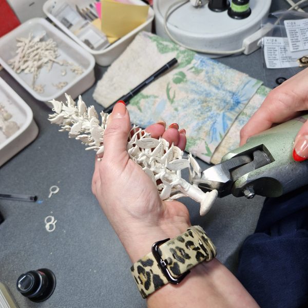 Once the metal has cooled and solidified, the can is removed from the machine and quenched in water. The plaster is washed out, leaving the solid silver tree. The casts are cut off the tree and then sent to me.